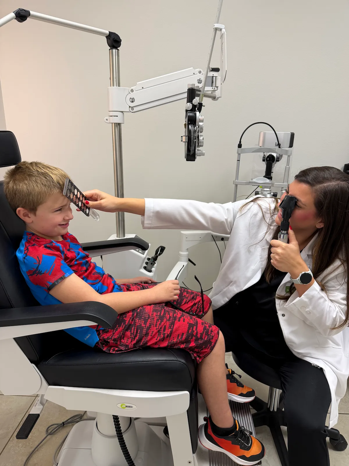Dr. Dani performing a pediatric eye exam