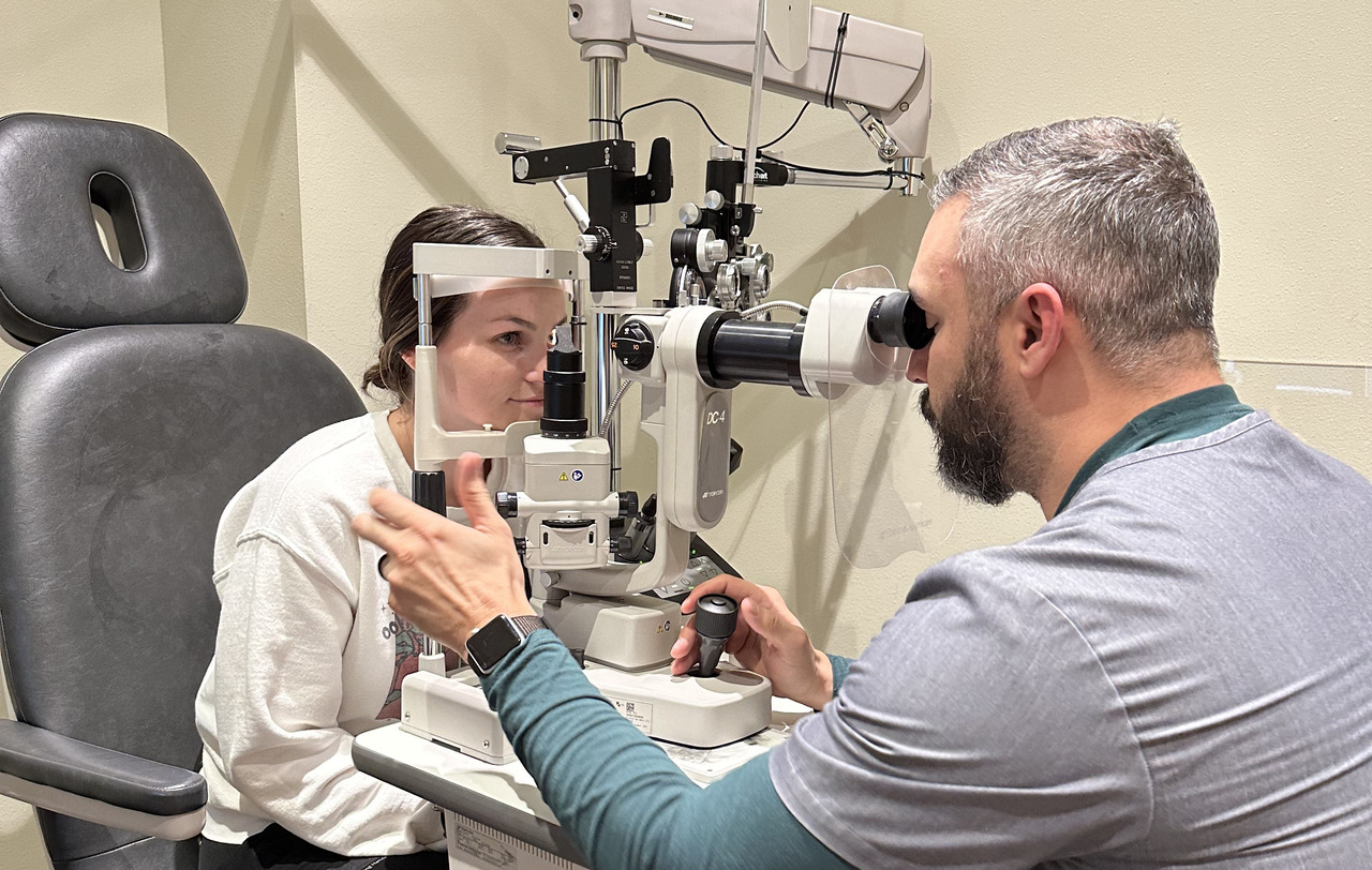 Help, eye test or black woman consulting doctor for eyesight at optometrist or ophthalmologist
